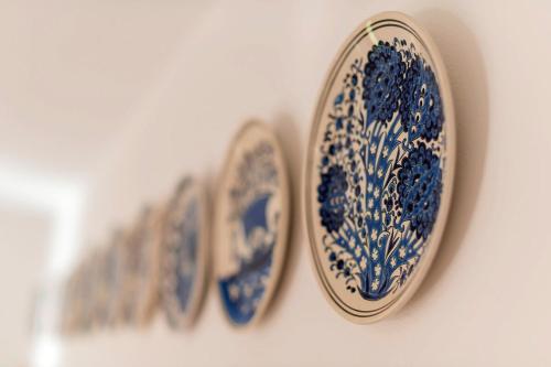 three blue and white plates on a wall at Villa Panagiota, Pefkos in Pefki Rhodes