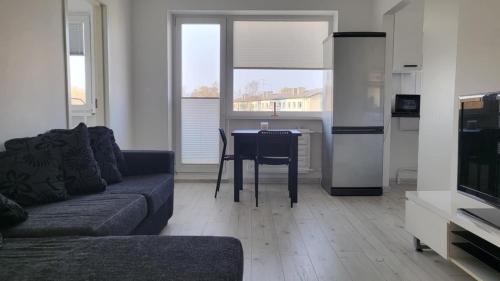 a living room with a couch and a table at DreamsNest in Tallinn