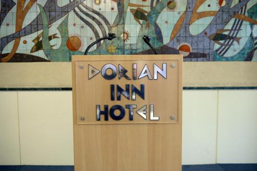 a wooden sign with the words worn in a hotel at Dorian Inn - Sure Hotel Collection by Best Western in Athens