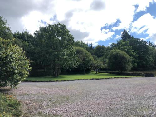 a park with trees and a grass field at The Steading at Barmore in Tarbert