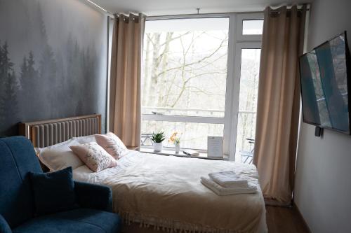 Ένα ή περισσότερα κρεβάτια σε δωμάτιο στο Apartament Ustroń 20