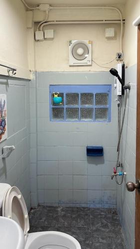 a bathroom with a toilet and a sink at Chubbi5 room11 in Bangkok