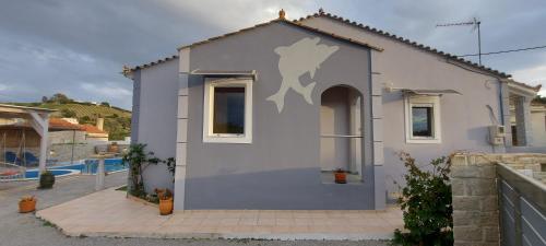 a small house with a painting of a horse on it at Villa Zahner in Pitsidia