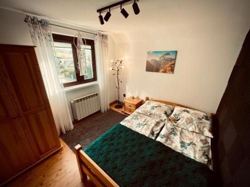 Ένα ή περισσότερα κρεβάτια σε δωμάτιο στο Chlebem i Miodem