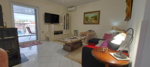 a living room with a couch and a table at Villa Zahner in Pitsidia