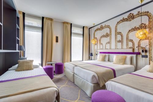 Postel nebo postele na pokoji v ubytování Hotel Yllen Eiffel