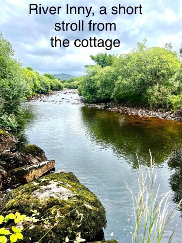 a river liminy a short stroll from the cottage at Beautiful newly renovated farmhouse in Gortatlea