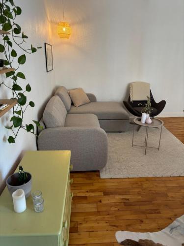 a living room with a couch and a table at Vejle Liv in Vejle