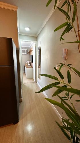 Ένα ή περισσότερα κρεβάτια σε δωμάτιο στο Apartamento sofisticado com garagem no centro