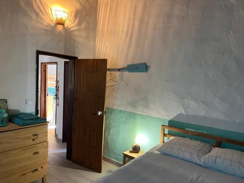 Postel nebo postele na pokoji v ubytování Villa Monte dos Pinheiros