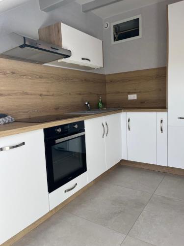 Kuchyň nebo kuchyňský kout v ubytování Appartement tout confort, cosy refait à neuf