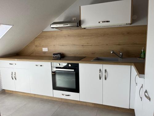 Kuchyň nebo kuchyňský kout v ubytování Appartement tout confort, cosy refait à neuf