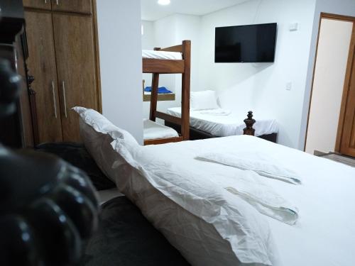 Ένα ή περισσότερα κρεβάτια σε δωμάτιο στο Casa Finca Hotel Loma Encantada