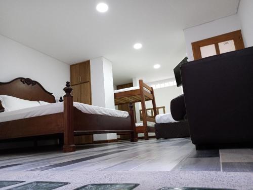 Ένα ή περισσότερα κρεβάτια σε δωμάτιο στο Casa Finca Hotel Loma Encantada