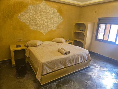 Кровать или кровати в номере Les jardins berbères d'Agadir