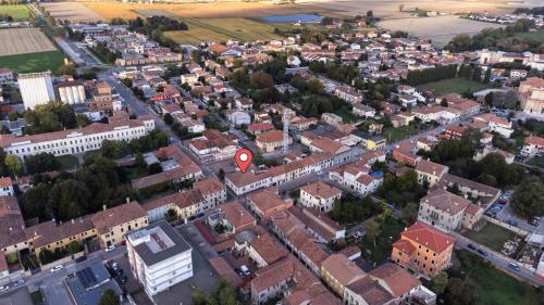 an aerial view of a city with a red sign at Santa Sofia Suite in Lendinara