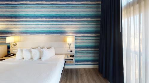 Postel nebo postele na pokoji v ubytování Hotel LBI