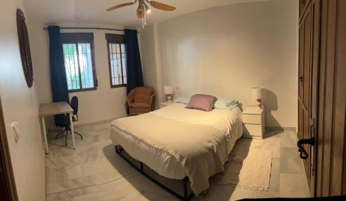 En eller flere senge i et værelse på Green By The Bay - La Herradura