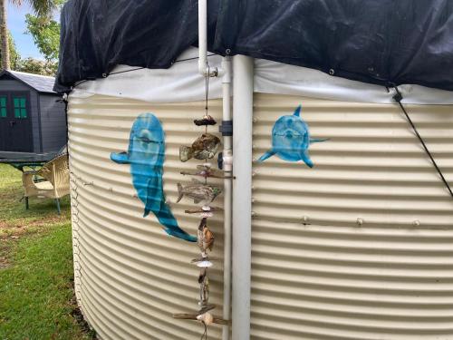 a large metal container with items on it with an umbrella at Comfort Nest in Pahoa