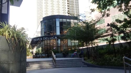 a building with a sign that reads caffe delia at Kler Condo Garden with City View in Tabok