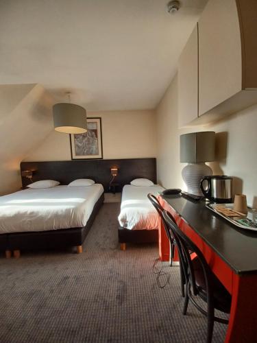 Postel nebo postele na pokoji v ubytování Hotel Koffieboontje