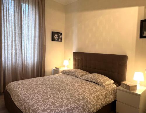 En eller flere senge i et værelse på Livraghi3 Cozy Apartment