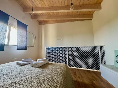 Postel nebo postele na pokoji v ubytování Villa Vittoria Suites
