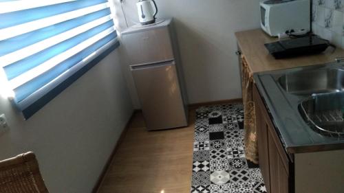 Η κουζίνα ή μικρή κουζίνα στο FEIDUM quarters flat