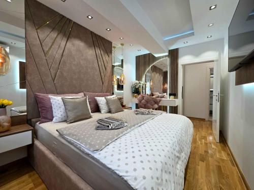 Ένα ή περισσότερα κρεβάτια σε δωμάτιο στο Oaza apartmani