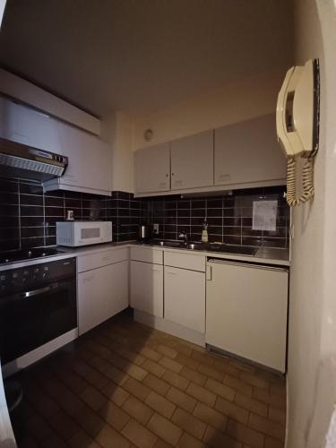 Kuchyň nebo kuchyňský kout v ubytování Hotel Koffieboontje