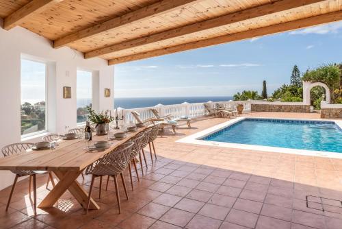Retreat with sea views & private heated pool!