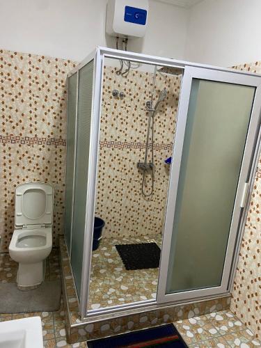 Uma casa de banho em JD Hotel