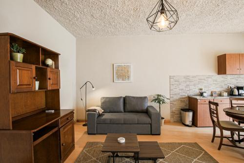 a living room with a couch and a table at Casa Pinheiro in Pinheiro de Coja