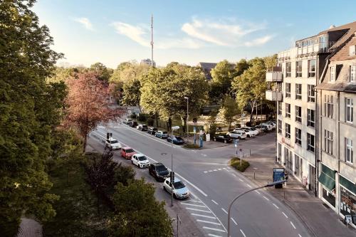 an aerial view of a city street with cars parked at Domblick 2 I Balkon I Parkplatz I Nähe Veltins-Arena in Gelsenkirchen
