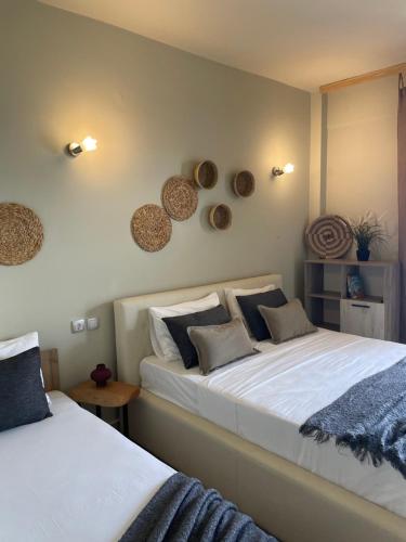 a bedroom with two beds at MOLA PAPAYA STUDIOS in Mola Kalyva