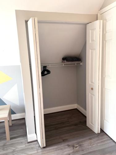a room with a closet with a door open at 5Guest House Baltimore County(own room, Joppa RD) in Parkville