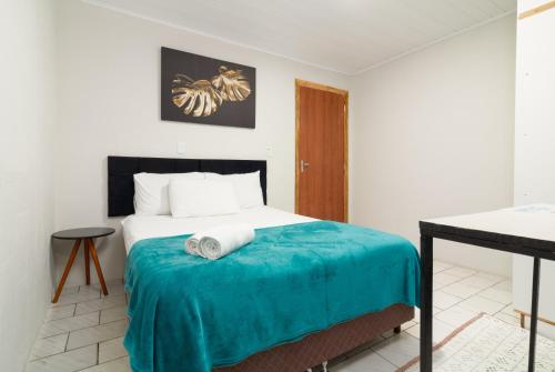 Ένα ή περισσότερα κρεβάτια σε δωμάτιο στο Suítes 91