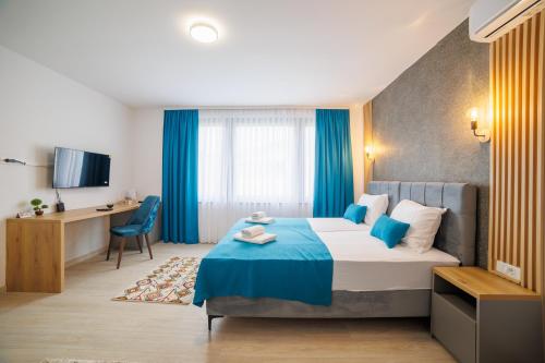 Ένα ή περισσότερα κρεβάτια σε δωμάτιο στο Aman Apartments