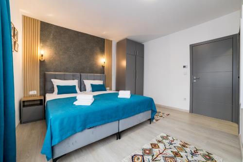 Ένα ή περισσότερα κρεβάτια σε δωμάτιο στο Aman Apartments