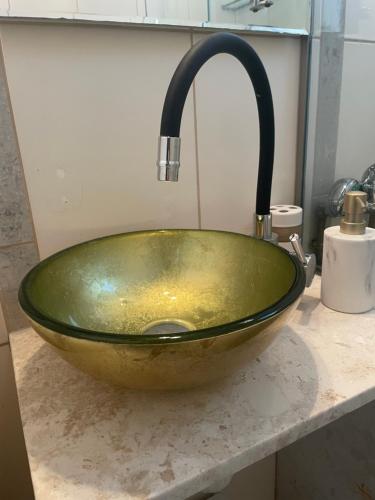 a green sink with a faucet on a counter at city spot in Ioannina