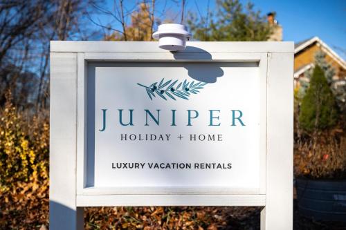 a sign for a jumber holiday homes home at Gray Haven in Union Pier