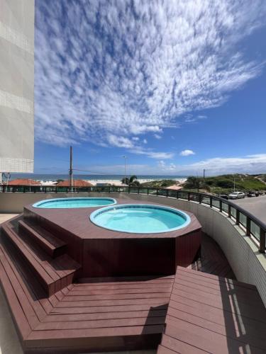 Bazén v ubytování Apartamento para até 6 pessoas - Orla da Praia Grande nebo v jeho okolí