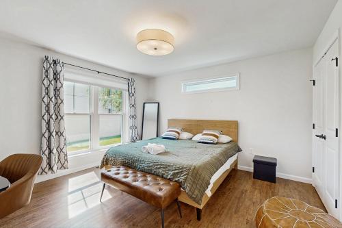 a bedroom with a bed and a window at Rehoboth Beach --- 35526 Dry Brook Drive Unit A in Rehoboth Beach