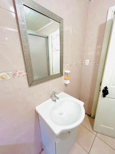 a bathroom with a sink and a mirror at Costa Morena in Constitución