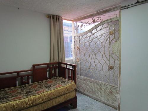 En eller flere senge i et værelse på Comodo apartamento Niquia