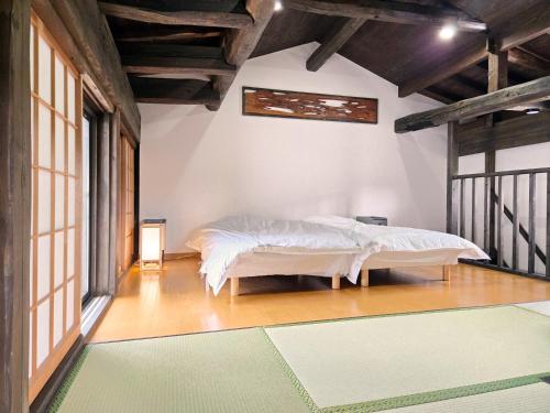 Postel nebo postele na pokoji v ubytování 一宿一景一生縁-千葉県四街道店