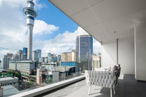 a balcony with a view of theuckland skyline at Quest on Hobson Serviced Apartments in Auckland