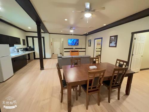 a dining room and kitchen with a table and chairs at Wells Gray Inn in Clearwater