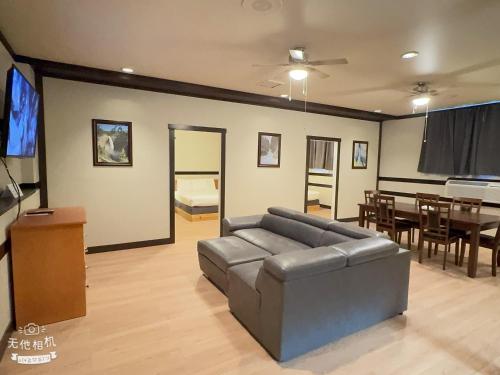 a living room with a couch and a dining room at Wells Gray Inn in Clearwater