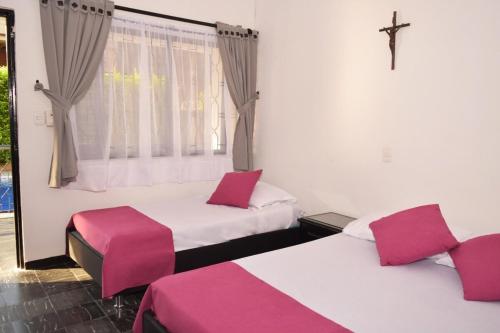 Postel nebo postele na pokoji v ubytování Quinta La Alborada